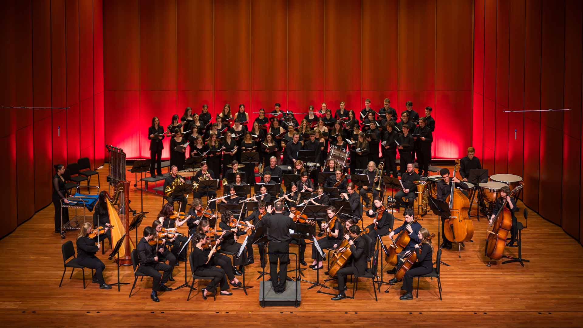 the holy cross orchestra and college choir performing together