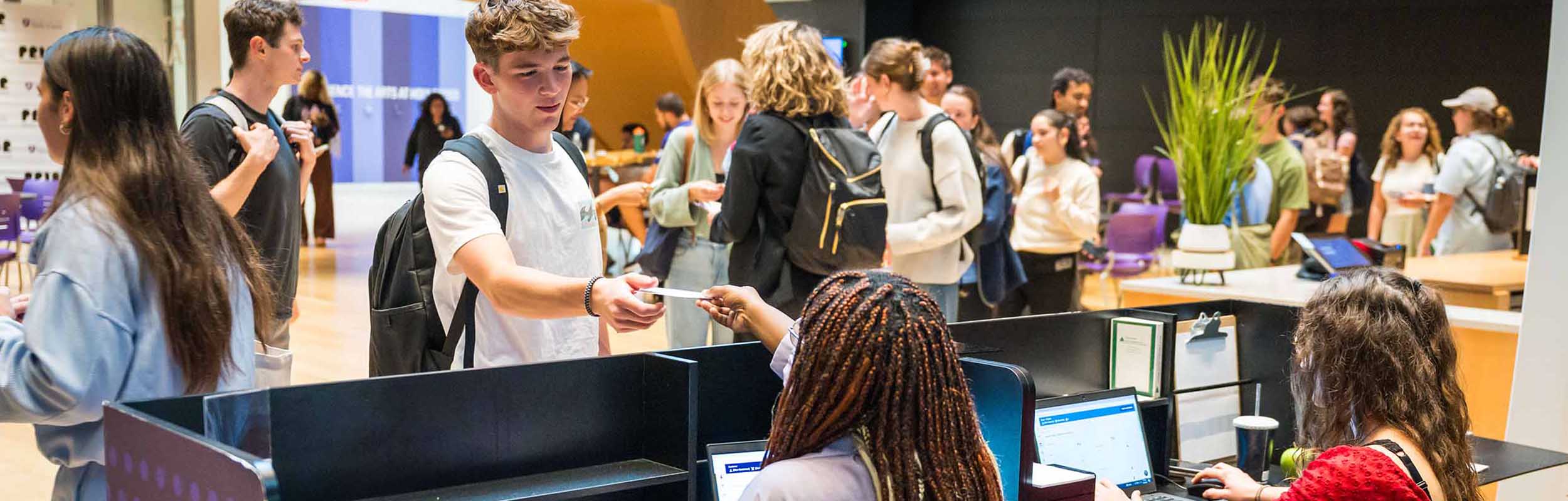 students at a visual arts reception