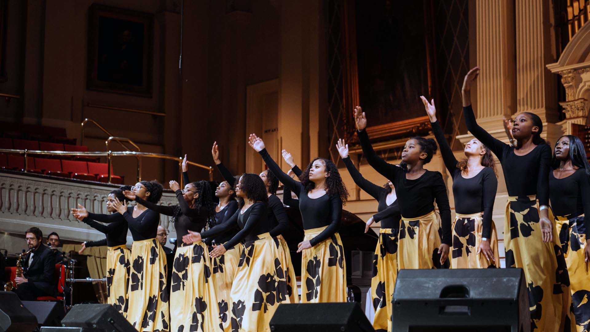 a choir singing at mechanics hall