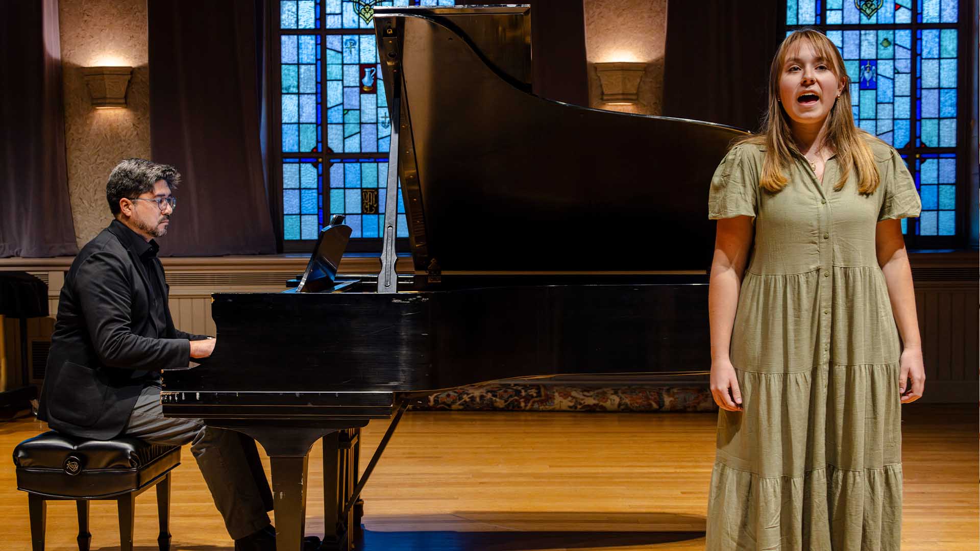 A student singing in Brooks Concert Hall