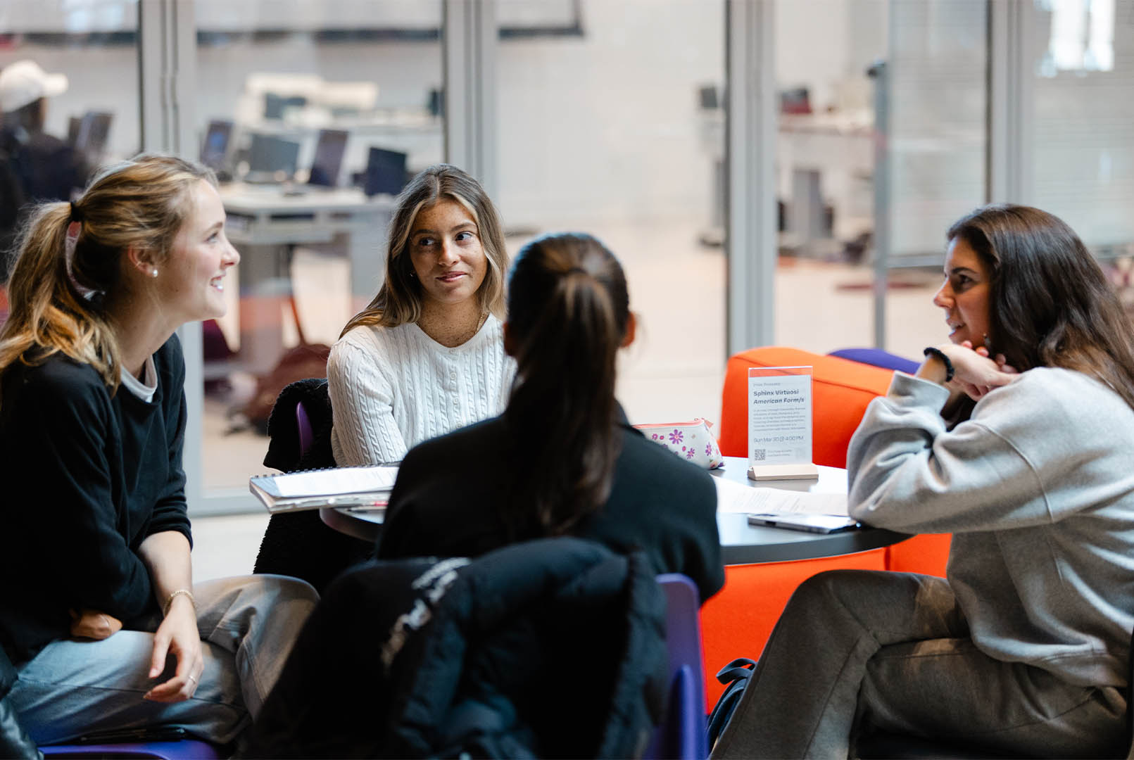students lounging in The Beehive atrium