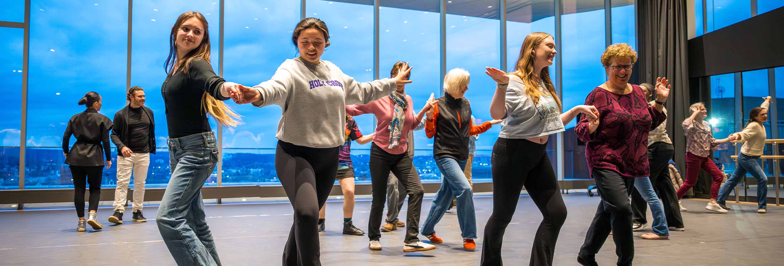 Students, staff and faculty in a swing dance class at the Alden Performance Studio in The Prior.
