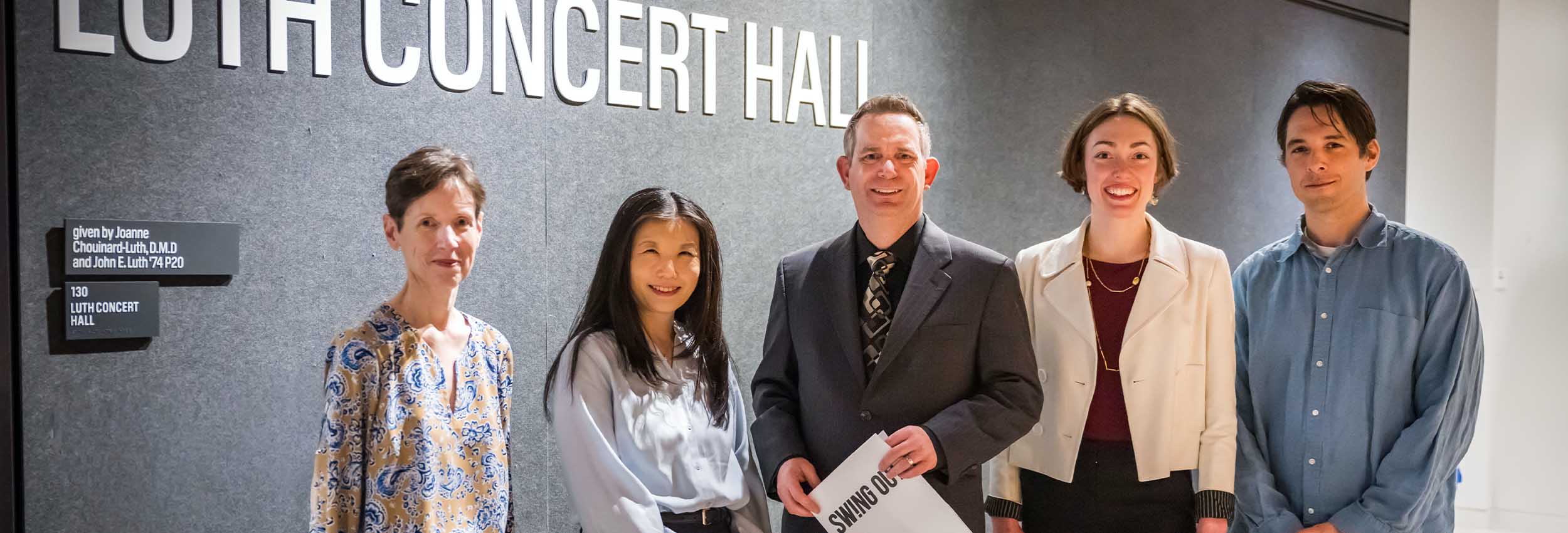Prior Director Jeffrey de Caen with Holy Cross Faculty in front of Luth Concert Hall