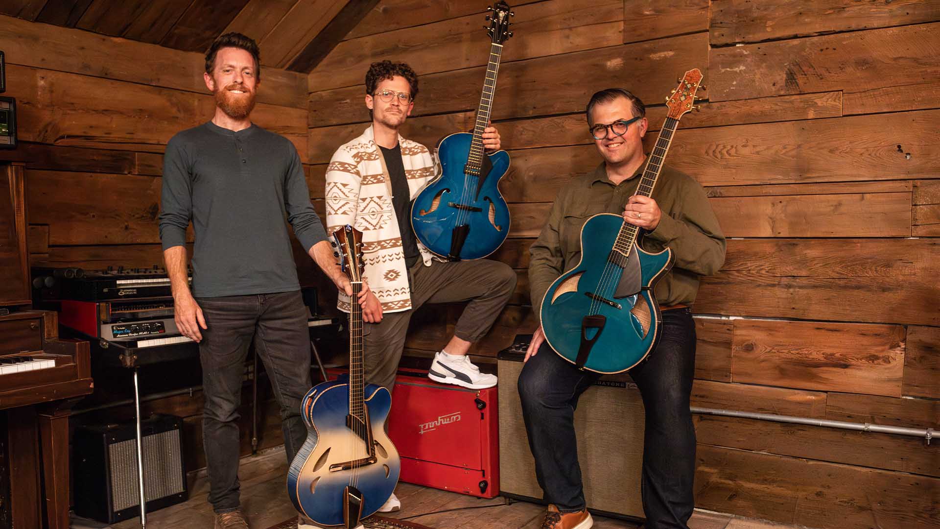members of New West Guitars with instruments from the Blue Guitars Project